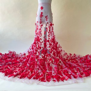 May include: Red 3D floral lace fabric with a delicate mesh background. The lace features large, raised flowers and leaves.
