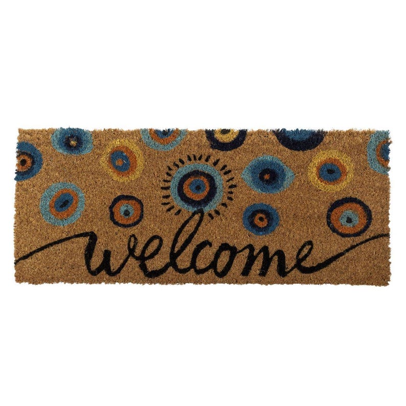 May include: A rectangular doormat made of natural fibers, featuring a repeating pattern of blue, yellow, and orange circular designs. The word "welcome" is written in a cursive font across the mat.