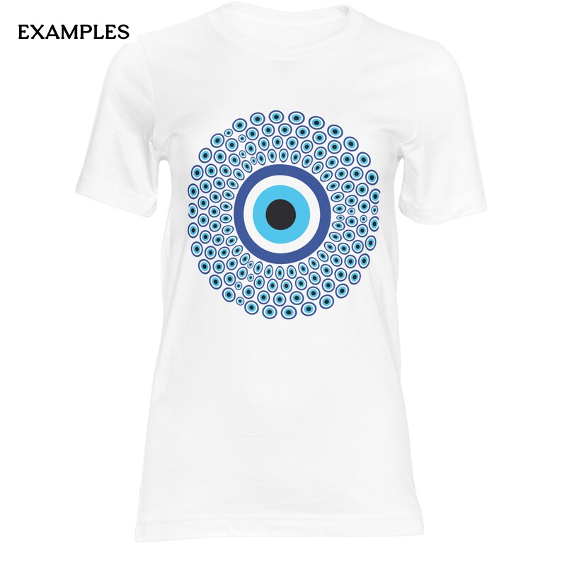 May include: A white short-sleeved t-shirt featuring a large, circular graphic on the chest. The design consists of a central black, light blue, and dark blue eye symbol surrounded by a dense pattern of numerous smaller blue and white eye motifs.