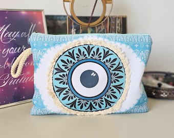 Trousse de maquillage à franges bleu clair, motif œil maléfique, style bohème tribal floral, avec fermeture éclair, idéale pour les voyages, la plage ou comme cadeau grec.
