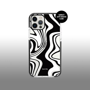 May include: A clear phone case with a black and white swirl pattern. The case has a black border and says "Impact Anti Shock Case" and "Talk & Tell" on the back.