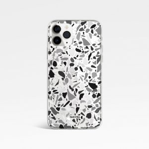 May include: A clear phone case with a black, white, and gray terrazzo pattern. The case has a "TALK & TELL" logo in the bottom right corner.