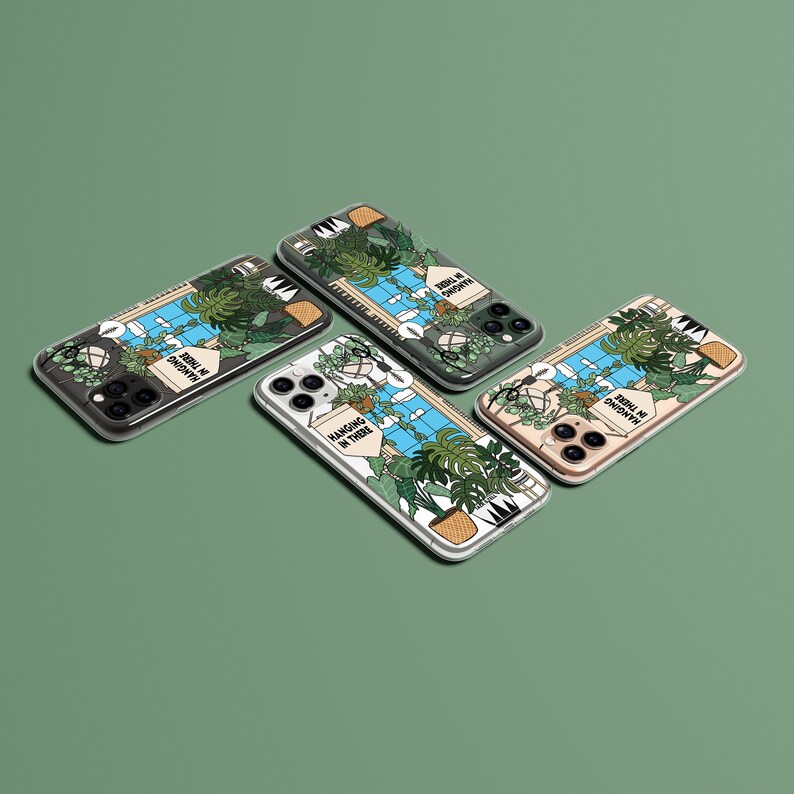 May include: Four different phone cases with a botanical theme. Each case features a different design with a variety of plants and the text "Hangin' in There" or "Still in Growth".