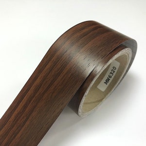 May include: A roll of brown woodgrain contact paper with the text "MW6320" printed on the label.