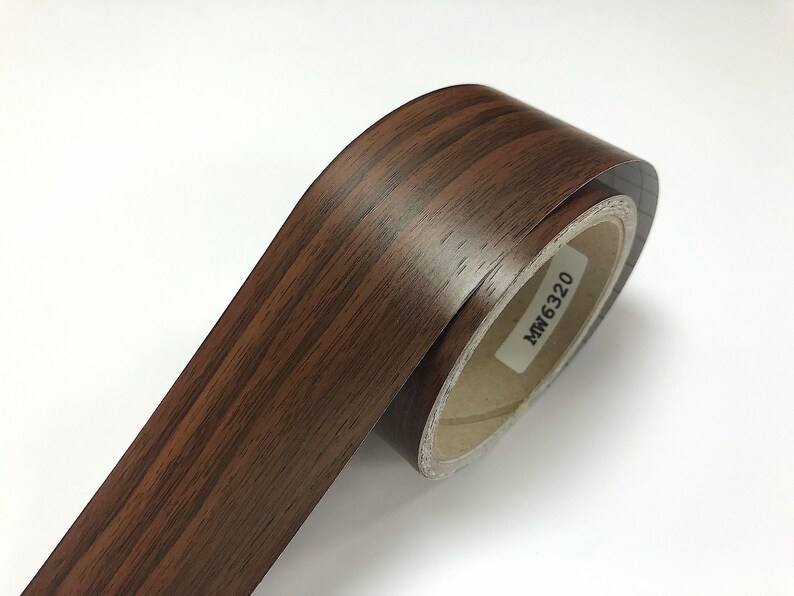 May include: A roll of brown woodgrain contact paper with the text "MW6320" printed on the label.