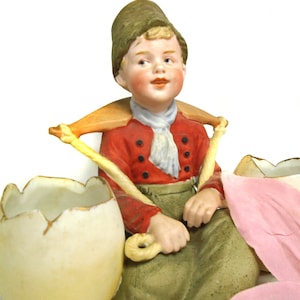 Gebruder Heubach Dutch boy porcelain figurine, antique egg carrier, bisque porcelain, green red colored, 6.1&quot; / 155 mm, Piano Boy Figure