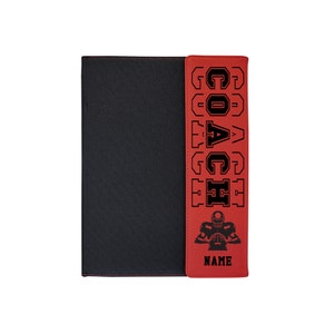 May include: Red leatherette notebook with a black cover and a black and red design on the spine. The design features the word "COACH" in black letters and a football player silhouette. The notebook has a red tab with the word "NAME" in black letters.