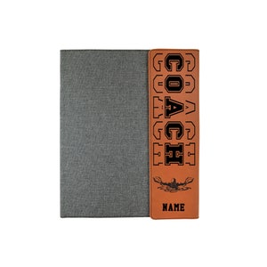 May include: Brown leatherette folder with a gray fabric cover. The front of the folder has the word "COACH" written vertically in black letters and a silhouette of a swimmer. The bottom of the folder has the word "NAME" written in black letters.