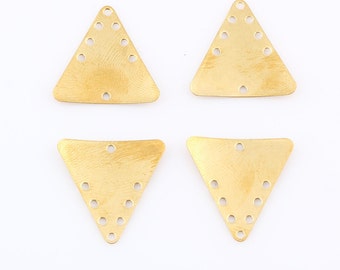 May include: Four gold-colored triangle-shaped metal charms with multiple holes. The charms are perfect for jewelry making or crafting projects.