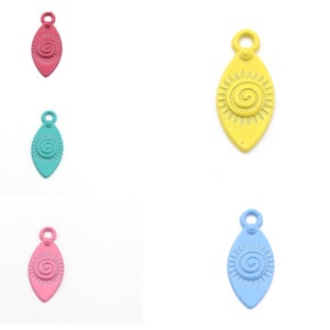 May include: Five metal charms in the shape of an oval with a spiral design inside. The charms are in the colors pink, blue, green, yellow, and red.