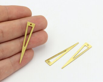 May include: Three gold-coloured metal triangle shapes with a hole at the top. The triangles are hollow and have a pointed tip.