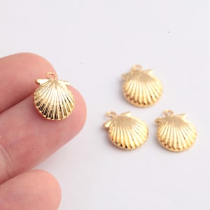 May include: Four gold-colored seashell charms with a loop for attaching to jewelry or other crafts.