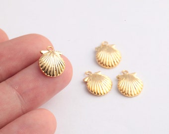 May include: Four gold-colored seashell charms with a loop for attaching to jewelry or other crafts.