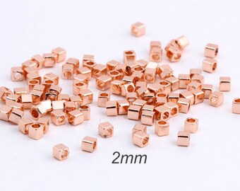 50個 2 mm ミニキューブビーズ、ローズゴールドメッキ真鍮チューブ