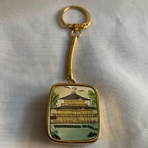 porte-clés boîte à musique Sakura vintage ton or avec mouvement Sankyo