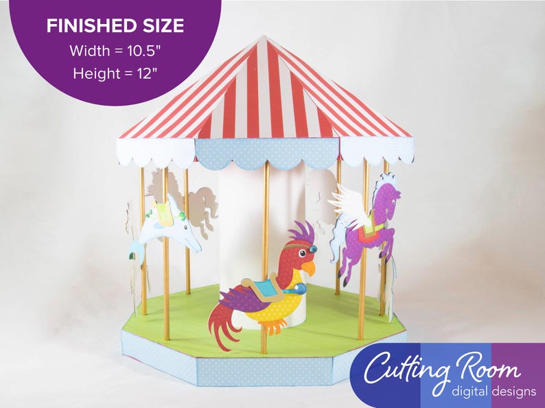 A papercraft carousel with a red and white striped roof, a white base, and a green platform. The carousel has eight animals: a red horse, a multicolor parrot, a yellow giraffe, a blue elephant, a yellow lion, and a purple unicorn, and violet Pegasus. The carousel is a digital download and is available in SVG format and measures 10.5" wide by 12" tall when fully assembled. A banner says it is about 10.5 inches wide and 12 inches high.