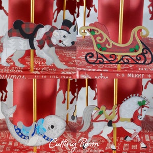 A red and gold carousel with four different ornaments. The ornaments are a white polar bear with a red and black plaid scarf, a red sleigh with green holly and red berries, a white narwhal with a blue and silver saddle, and a white horse with a red and white striped saddle and green holly.