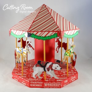A red and white striped carousel with a polar bear, reindeer, and other animals. The carousel is decorated with green garland and has a red base with a Christmas themed pattern.