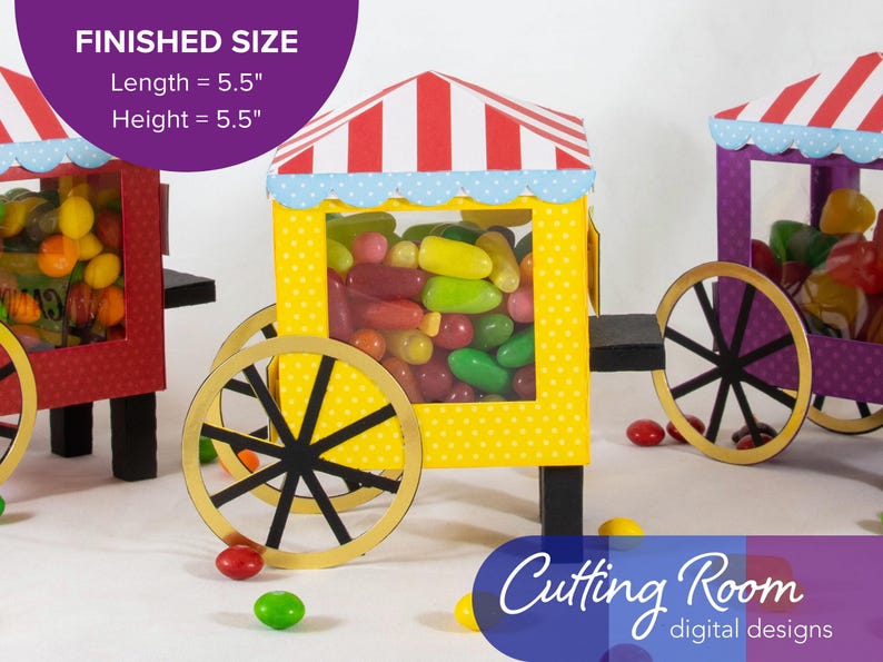 Three papercraft candy carts with red, yellow, and purple bodies. Each cart has a striped red and white roof with a scalloped blue trim. The carts are filled with colorful jelly beans and have black wheels with gold rims. The text 'Cutting Room digital designs' is in blue on a purple background.  There is a banner indicating that they are each about 5.5 inches long and 5.5 inches tall.