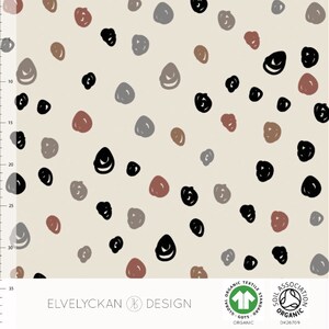 Organic jersey fabric with dots. Elvelyckan Confetti, organic cotton. Beige fabric