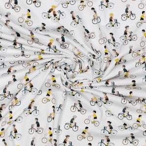 White jersey fabric with bicycles and cyclists. Cycle fabric. Oeko-tex standard.
