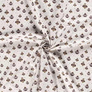 White cotton with Christmas decorations, baubles. Woven fabric with gold print