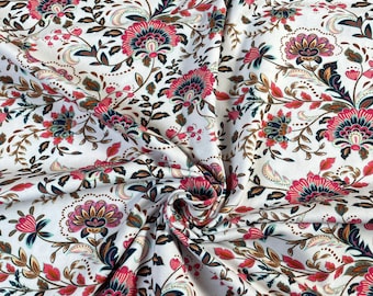 White jersey fabric with flowers. Flower fabric, flower jersey