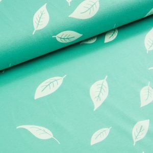 May include: Teal fabric with a white leaf pattern. The leaves are scattered randomly across the fabric.