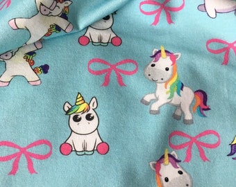 Blue jersey fabric with unicorns