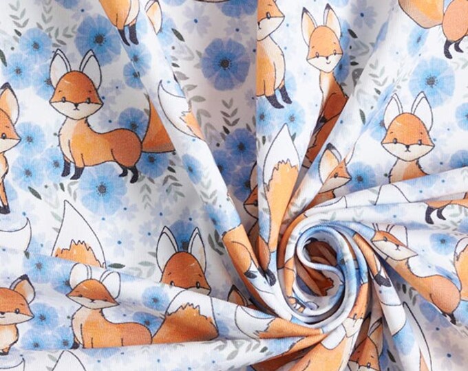 Wit en blauwe tricot stof met vossen