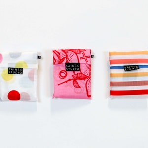 3 x Pocket Shopping Bags. Re-usable foldable bag. Fun bright prints. Compact Small Pouch. Strong bag. Australian owned and designed.