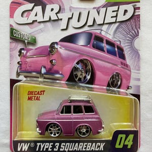 May include: A Car Tuned Series 11 diecast metal VW Type 3 Squareback toy car in a metallic purple finish with chrome wheels and a roof rack. The packaging features a pink illustration of the car, the text Car Tuned, Customs, and 04.