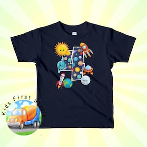 May include: A navy blue t-shirt with a white number four surrounded by space-themed illustrations, including planets, stars, rockets, and a UFO. The text "Kids First Studio" is visible in the lower left corner of the image.