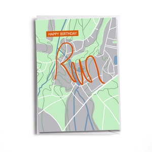 May include: A greeting card with a map design and the word "Run" written in orange. The card has a green and gray background with a blue river and the text "Happy Birthday" in a white box.