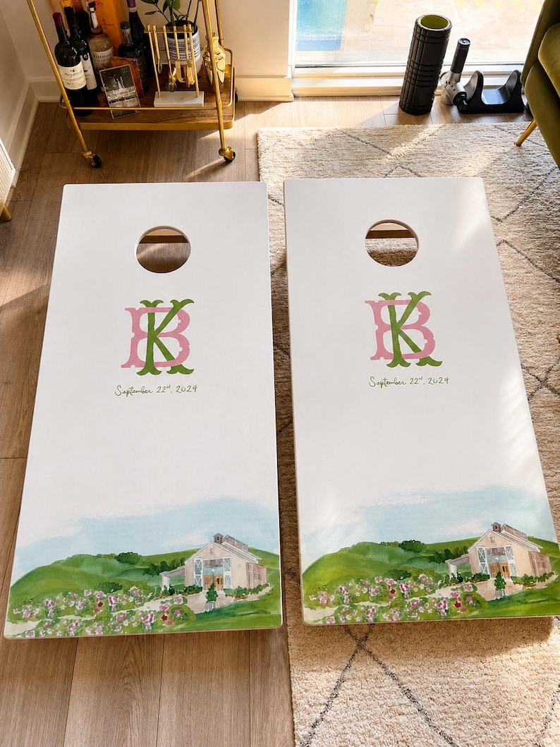 Custom Wedding Monogram Cornhole Boards Set, personalized wedding gift, and perfect groomsman gift. This custom cornhole set includes monogram cornhole with bags, custom logo boards and a wedding decal. Ideal for backyard games, this custom game board features premium cornhole boards, cornhole board, corn hole boards, customboards and a cornhole score board. Includes two white wooden boards with a pink and green KB monogram and the date September 17, 2024.