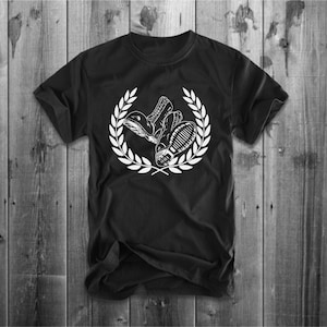 May include: Black t-shirt with a white graphic of two boots in a laurel wreath.