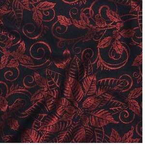 May include: Red and black fabric with a repeating pattern of poinsettia flowers and swirls.