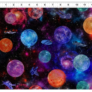 May include: A colorful space-themed fabric with planets, stars, and spaceships. The fabric features a dark blue background with bright colors like red, orange, blue, and purple.