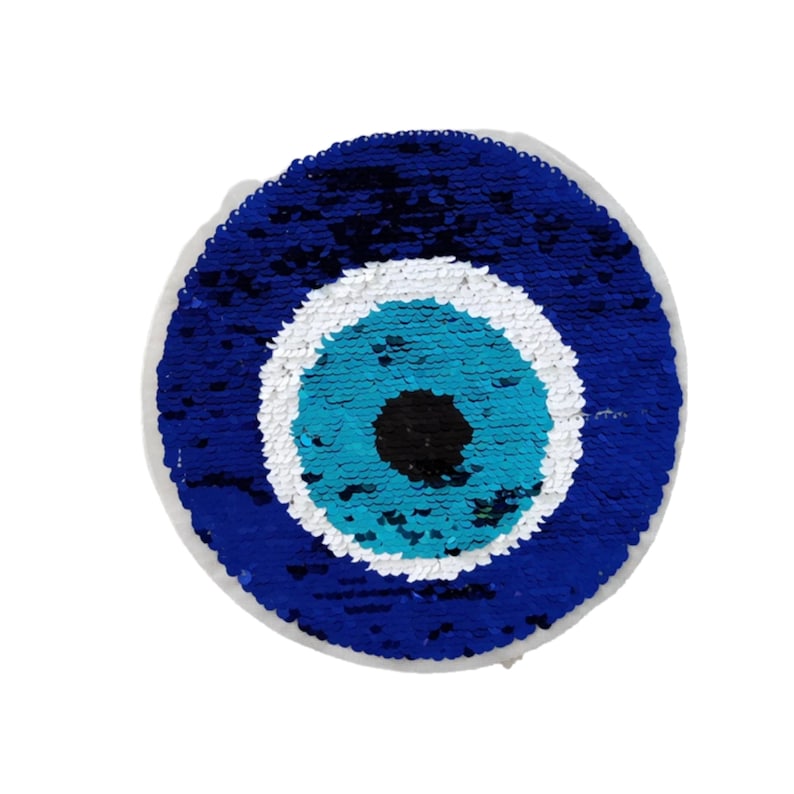 May include: A blue and white evil eye charm made of sequins. The eye is surrounded by a blue circle and a white circle.
