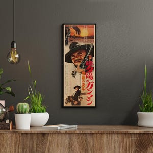 a framed poster of a cowboy on a wall, surrounded by potted plants and other decorative items.