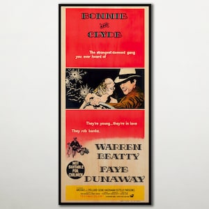 May include: A vintage film poster for the movie "Bonnie and Clyde" starring Warren Beatty and Faye Dunaway. The poster is red and black with a scene of the two actors in a car. The text on the poster reads "The strangest damned gang you ever heard of. They're young... they're in love. They rob banks."