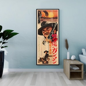 a framed movie poster of a man with a gun, hanging on a wall in a living room setting.