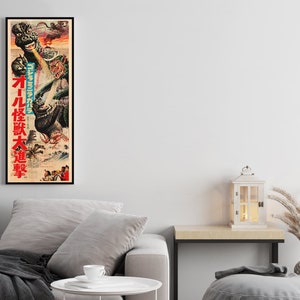 a living room with a gray couch and a poster on the wall
