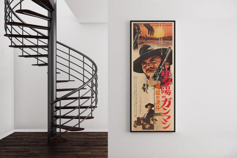 a spiral staircase and a framed poster of a movie poster for "The Magnificent Seven" on a wall.