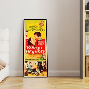 a room with a white couch and a poster on the wall