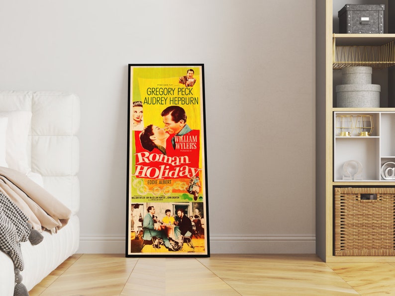 a room with a white couch and a poster on the wall