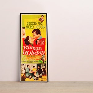 a picture of a movie poster hanging on a wall