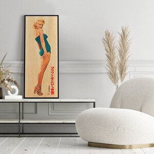 a picture of a woman in a bathing suit on a wall