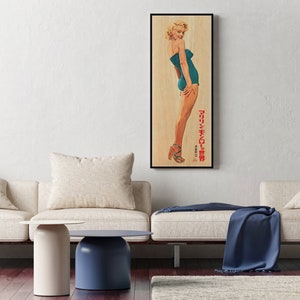 a living room with two couches and a painting on the wall