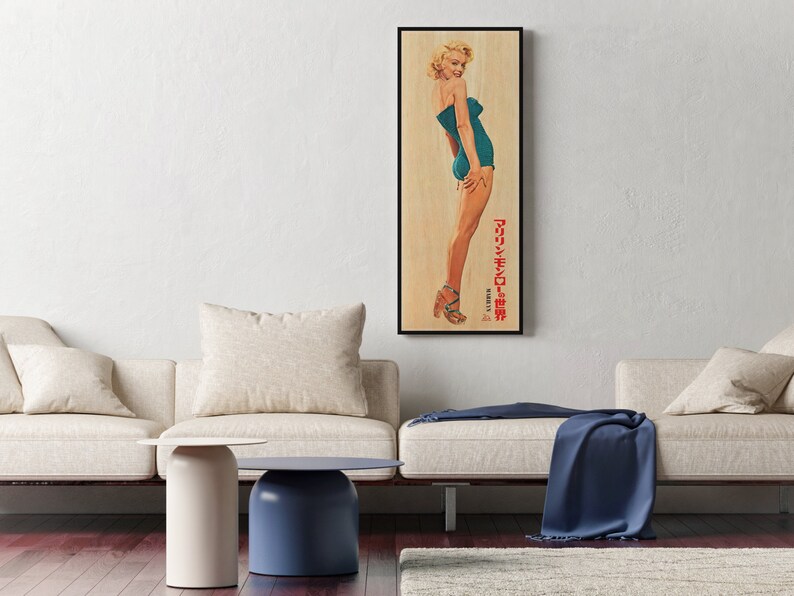 a living room with two couches and a painting on the wall